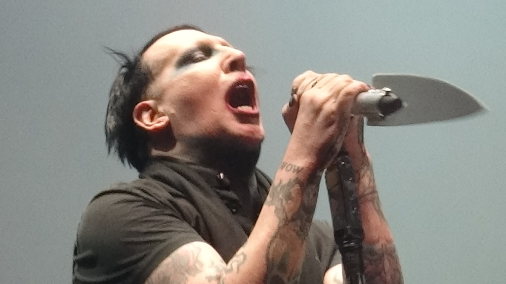 Marilyn Manson performing with mic