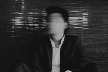 Blurred businessman in dark suit