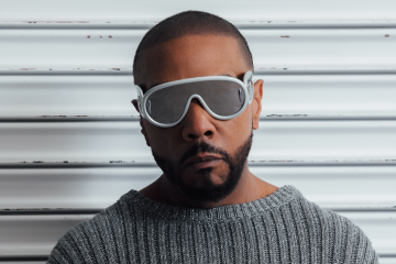 Timbaland wearing goggles and sweater