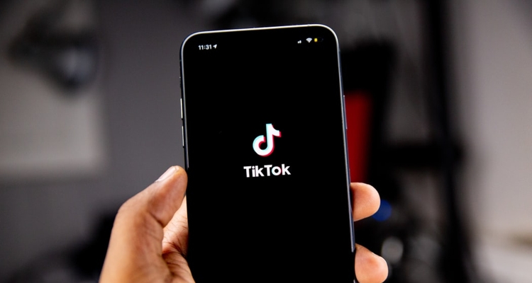 Hand with TikTok app on phone