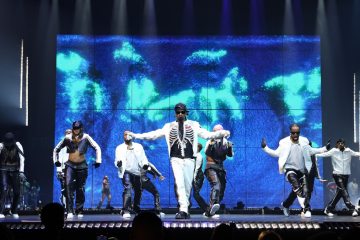 Usher performing on stage during concert