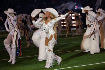 Beyoncé performing in a white outfit