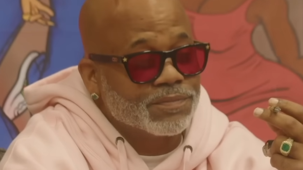 Damon Dash wearing pink sweatshirt