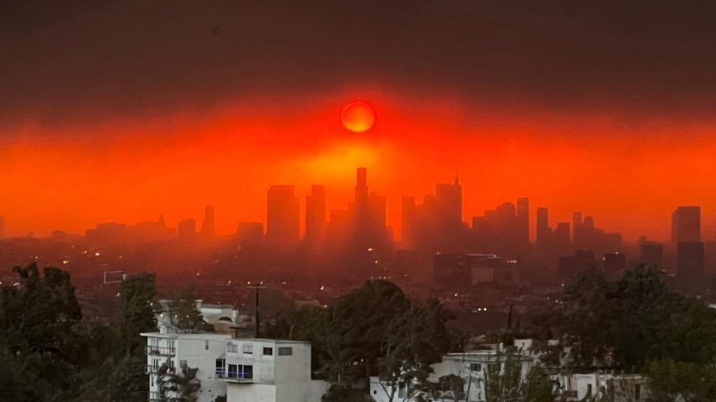 Los Angeles skyline against wildfire sky