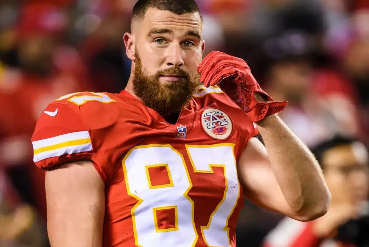 Travis Kelce celebrating on football field